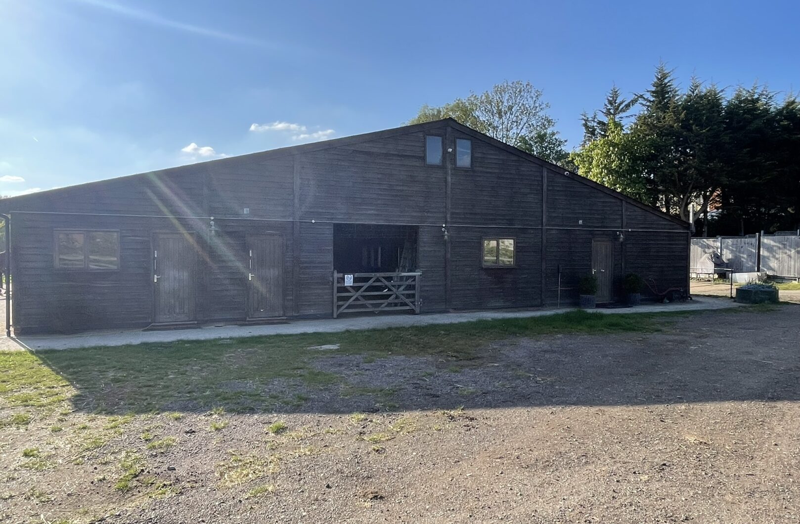 Large american barn front on with sliding doors open.