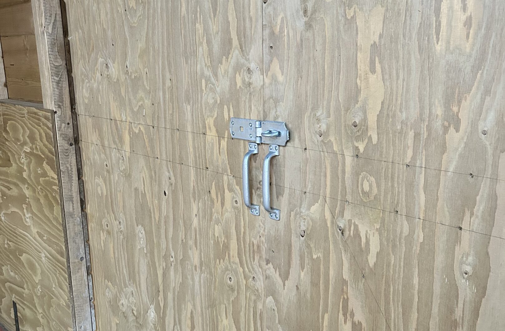 Interior of sliding door, showing handles and fully lined