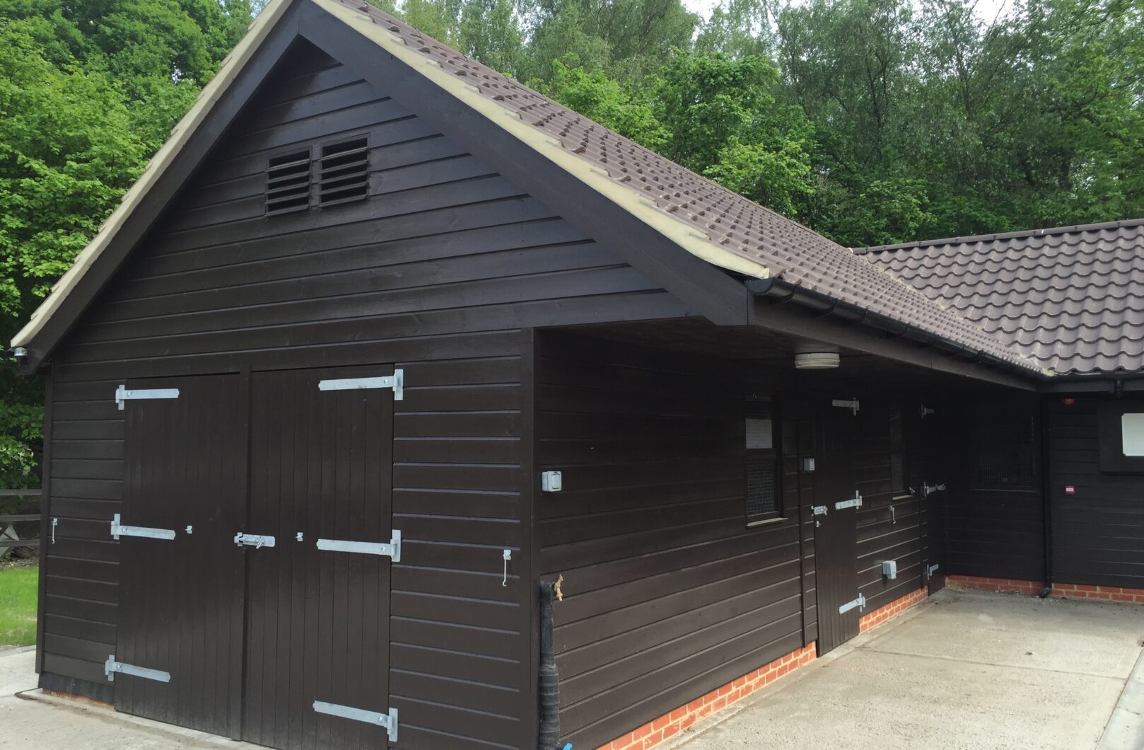 Black stable block with clay tiles,