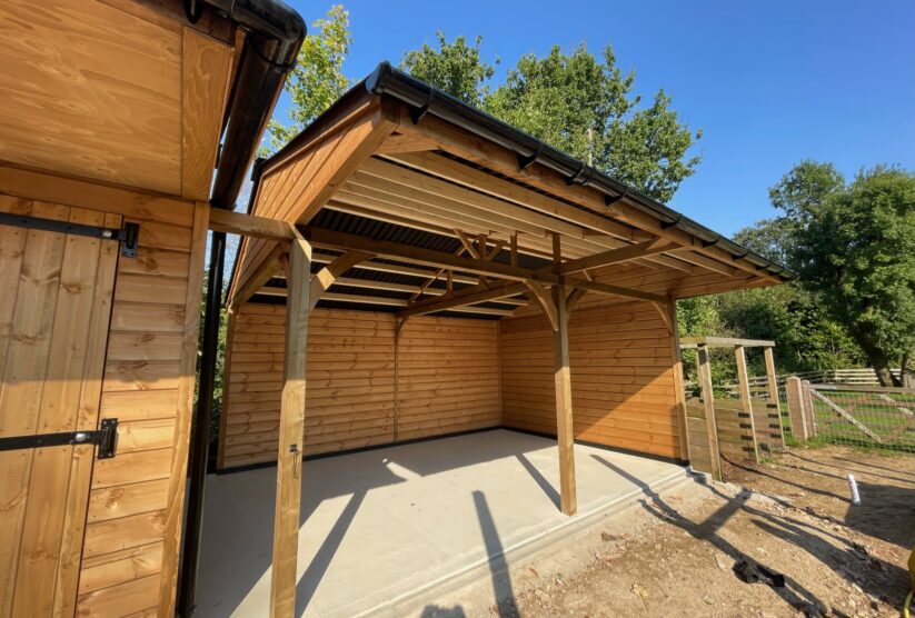 Covered walkway next to stables