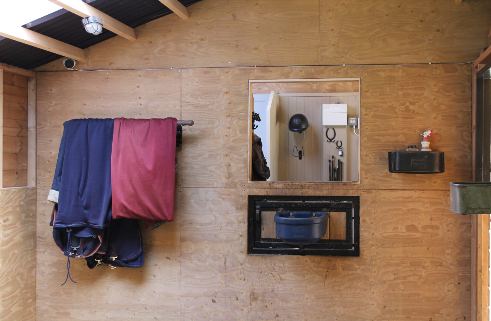 Inside corner box with opening to tack room