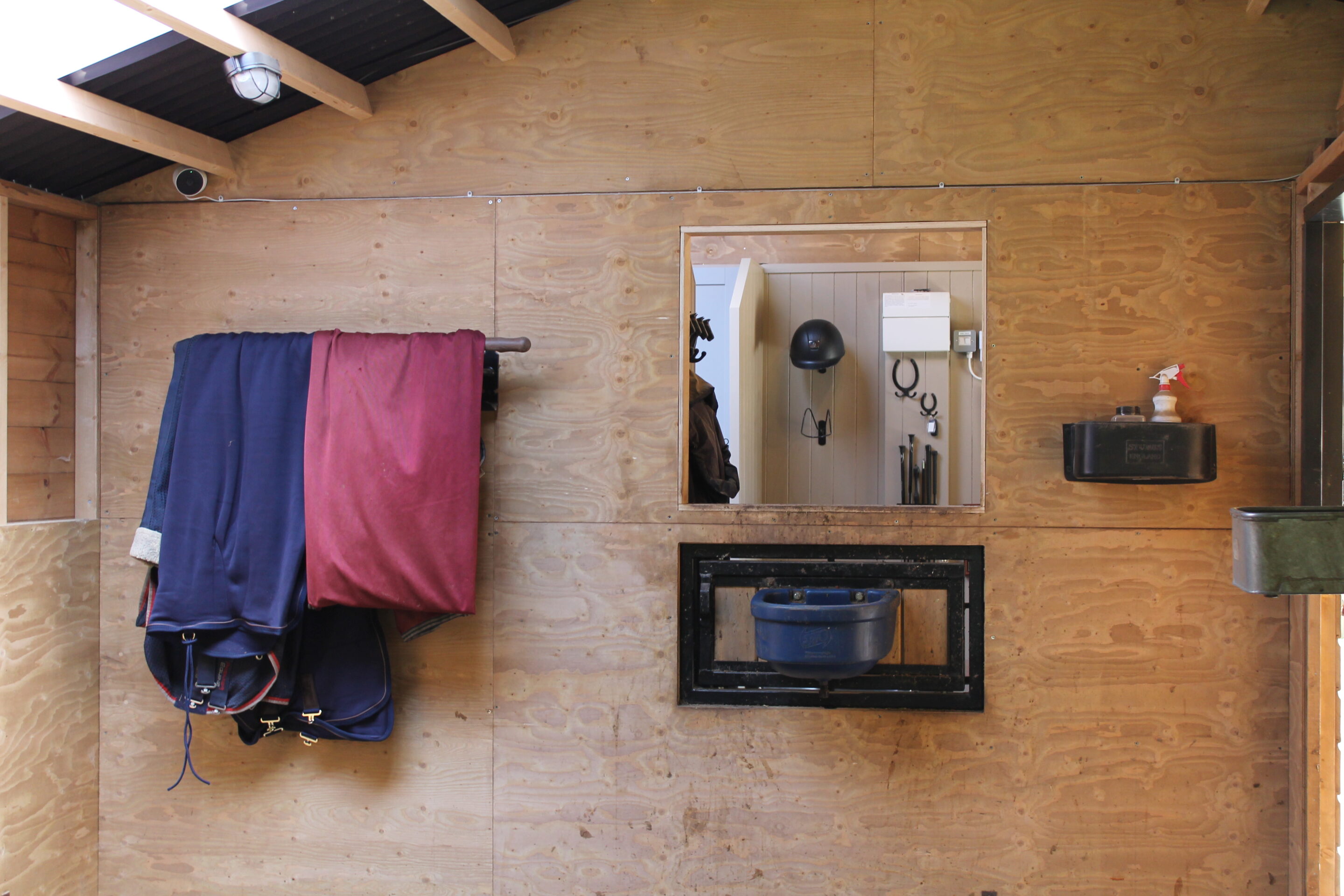 Inside corner box with opening to tack room