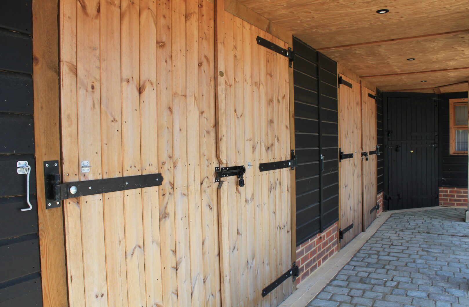 Barn doors with black ironmongery