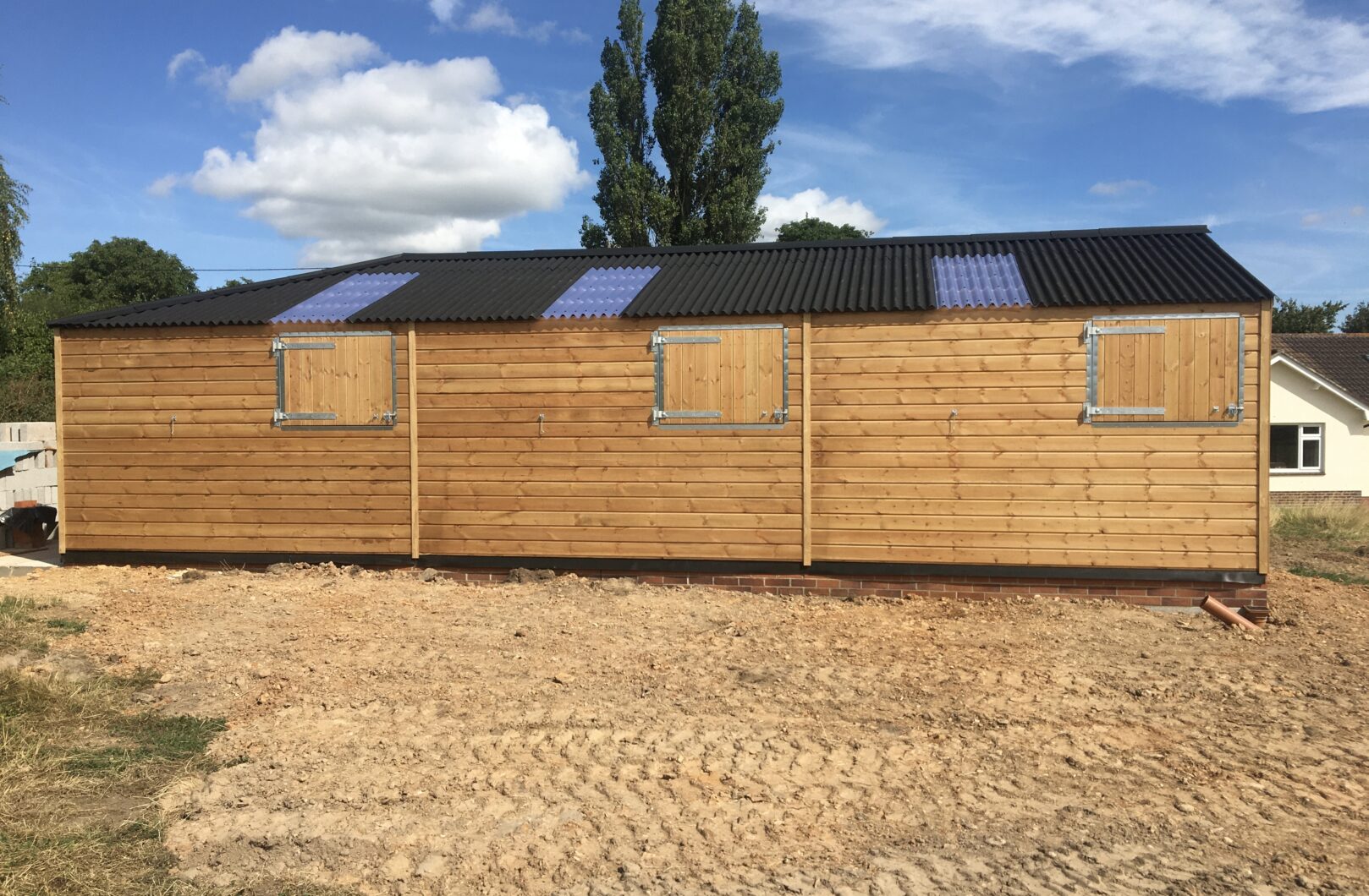 Back side of building with rear top stable doors closed