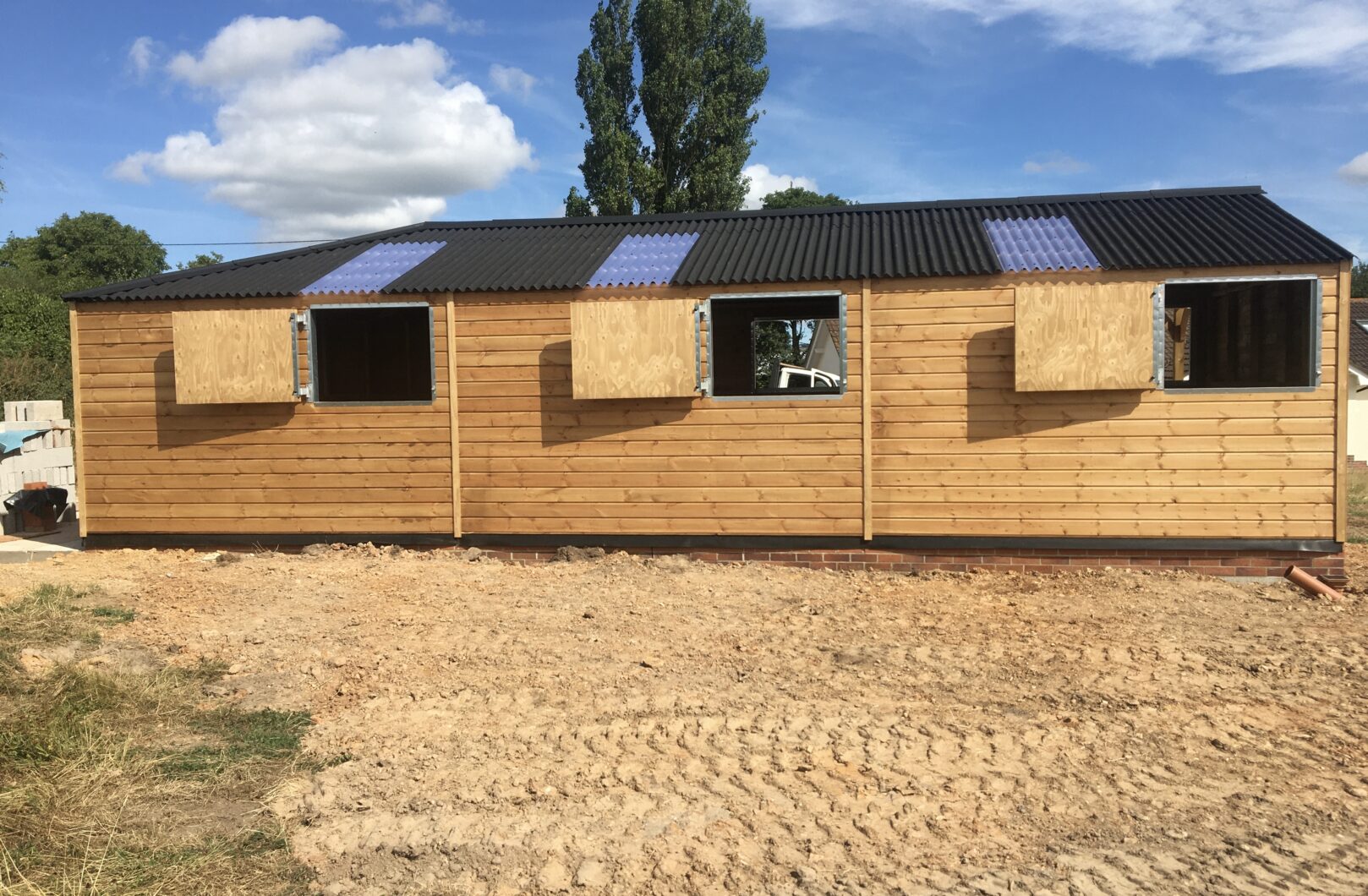 Back side of building with rear top stable doors open