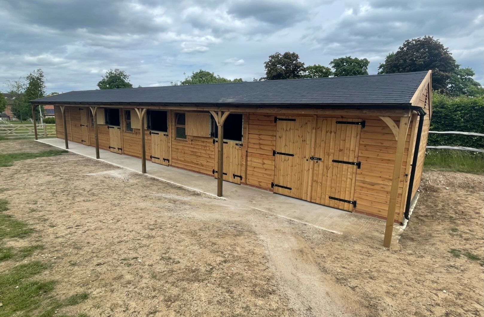 Long Stable Block with Black Ironmongery and Felt Shingles