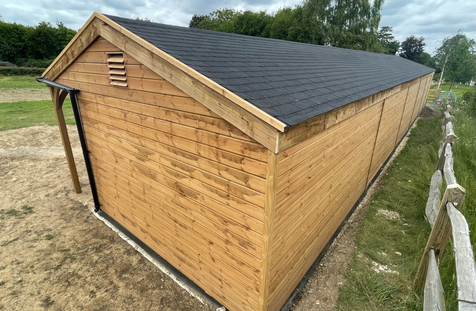 Long Stable Block with Black Ironmongery and Felt Shingles backside