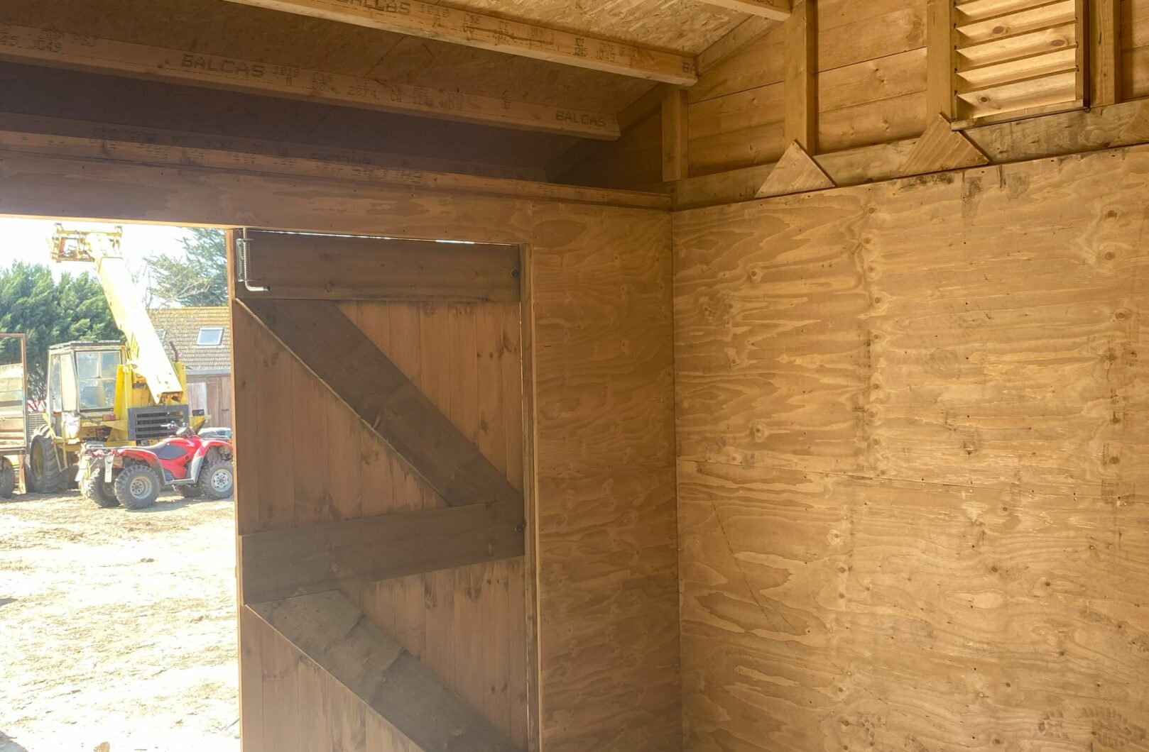 Fully lined hay barn internal and door