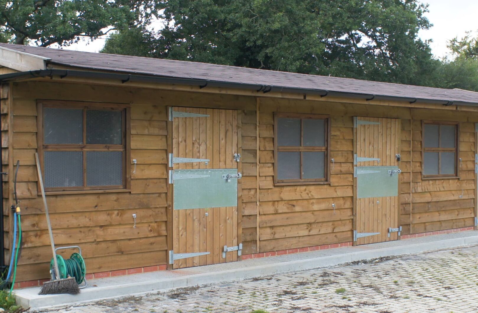 Stable Block with Featheredge Cladding and Felt Shingles front