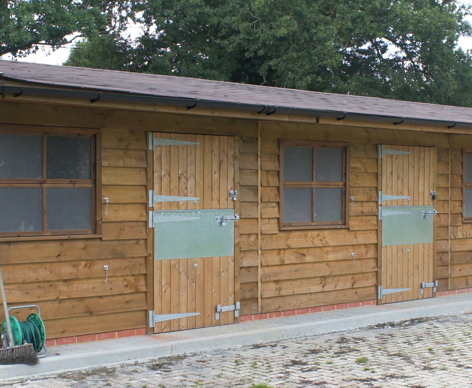 Stable Block with Featheredge Cladding and Felt Shingles front