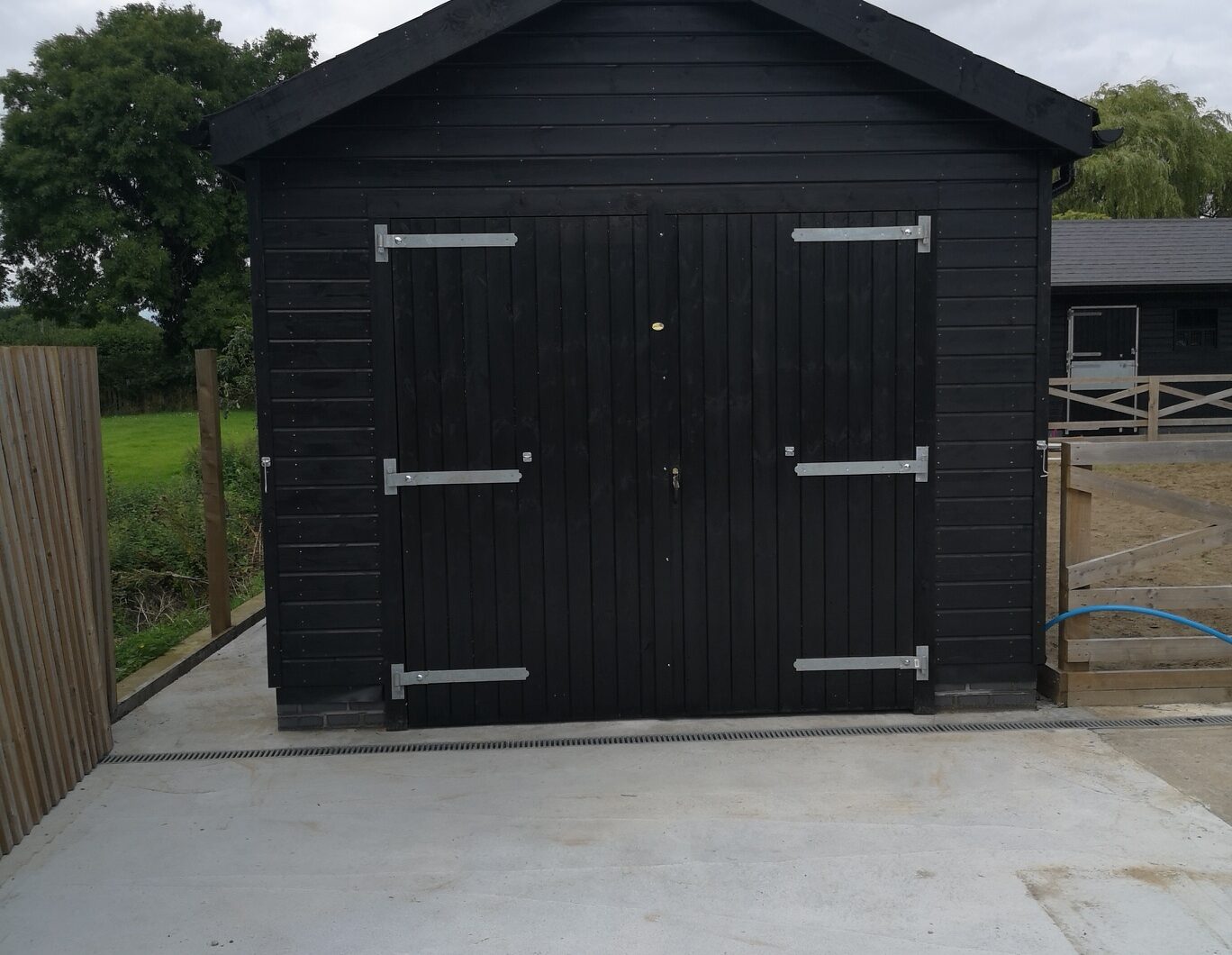Black stable block barn doors with silver ironmongery