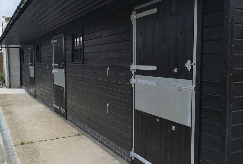 Black stable with extra deep door frame protection and silver ironmongery