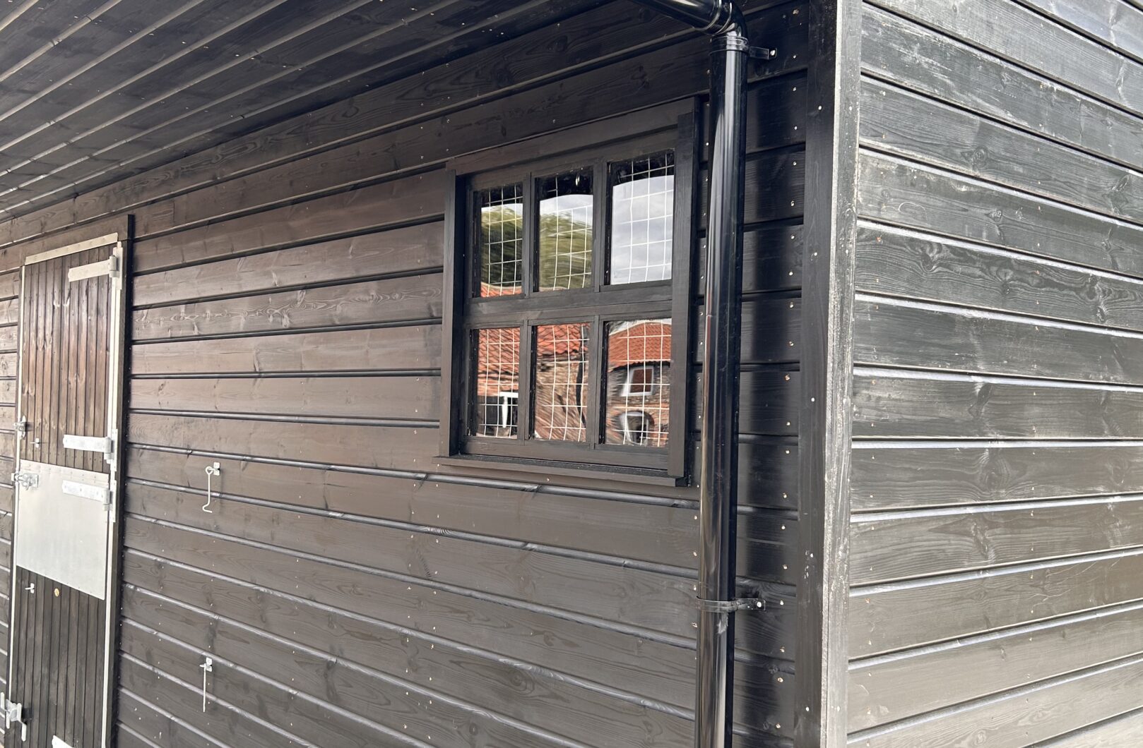 Black stable with 6-pane window