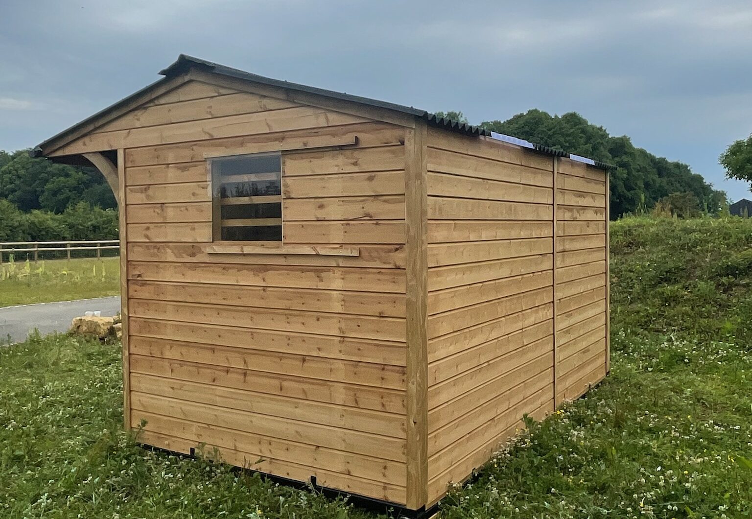 Dinkey donkey stable in paddock, rear side
