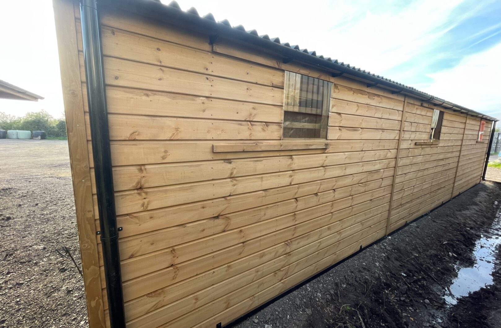 Rear side of triple mobile stable, x3 sliding perspex windows are visible