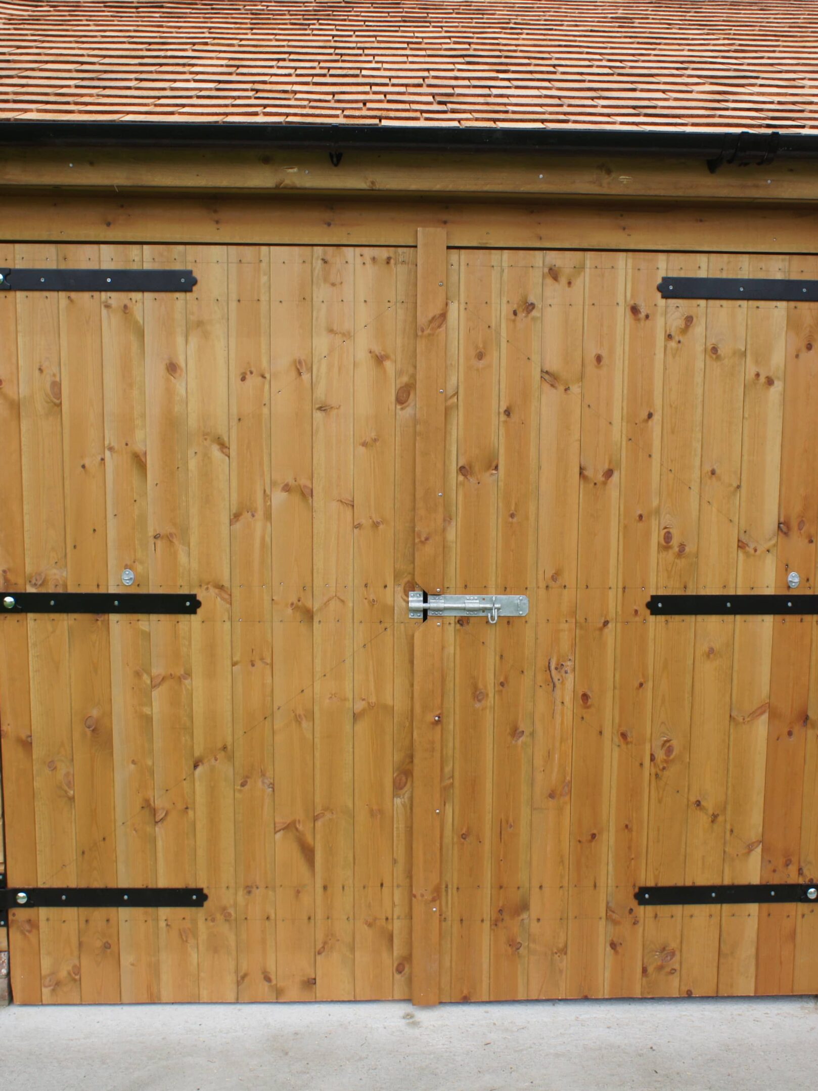 Barn door with black ironmongery