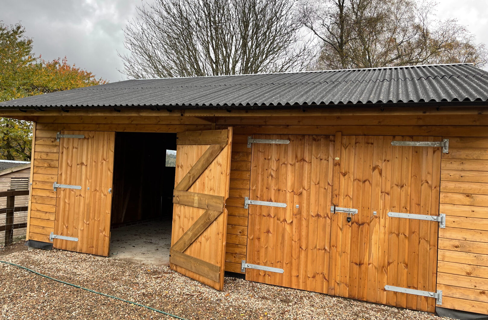 Double Garage with Overhang left door open