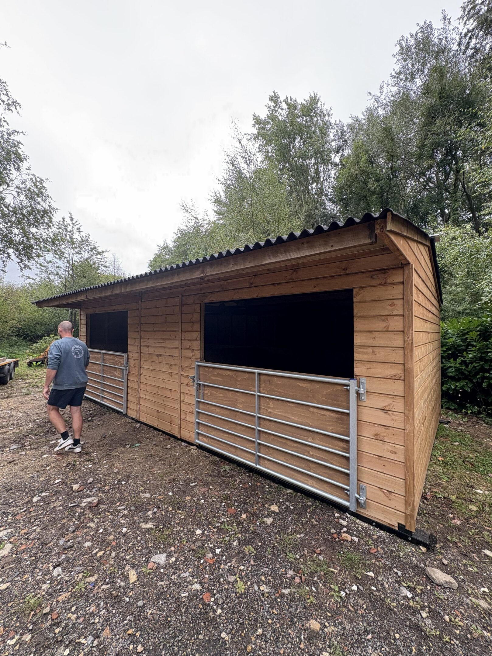 Craftsmen infront of mobile field shelter