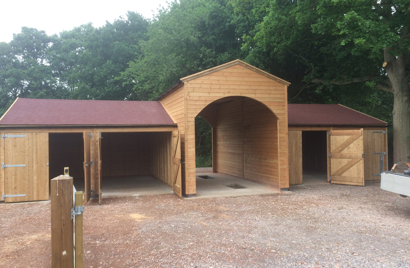 Garage with Ride Through Archway and Felt Shingles front side open