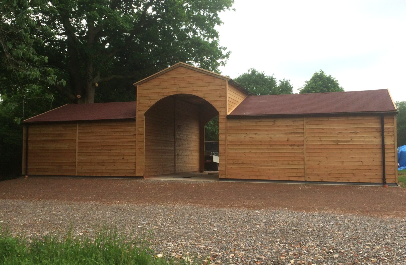 Garage with Ride Through Archway and Felt Shingles